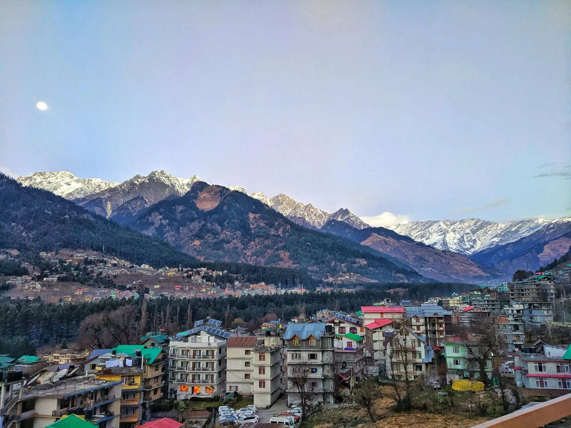 a view of a city with mountains in the background